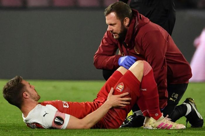All over? Arsenal's Aaron Ramsey suffers a suspected hamstring injury