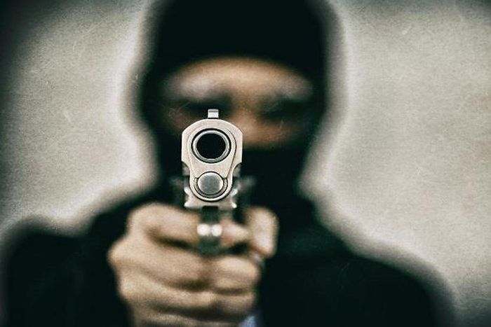 Anonymous man in black mask and gun (Dailytrust)