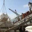 Yemeni workers unload wheat provided by the UN childrens's agency in Hodeida in January, 2018, before fighting for the lifeline aid port erupted between the rebels and the Saudi-backed government in June