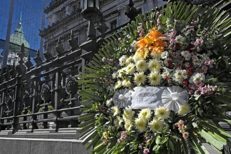 A floral wreath outside Buenos Aires' Congress building where lawmaker Hector Olivares was fatally wounded in a shooting last week that left his friend Marcelo Yadon dead at the scene