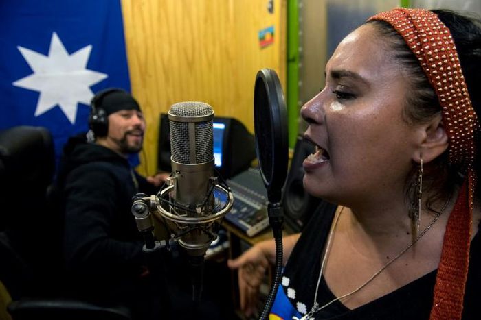 Filutraru Paillafilu (L) and Ana Millaleo, members of the Wechekeche Ni Trawun rap group, rehearse in Santiago