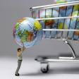 (FILES) In this file illustration made in Paris on November 8, 2015 shows a figurine with a globe next to a miniature shopping cart.Scientists and diplomats from 130 countries are meeting from April 29, 2019 in Paris to adopt the first global assessmen...