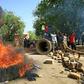 Sudanese protesters block one of Khartoum's main thoroughfares, Nile Street, with burning tyres as they keep up their campaign for civilian rule