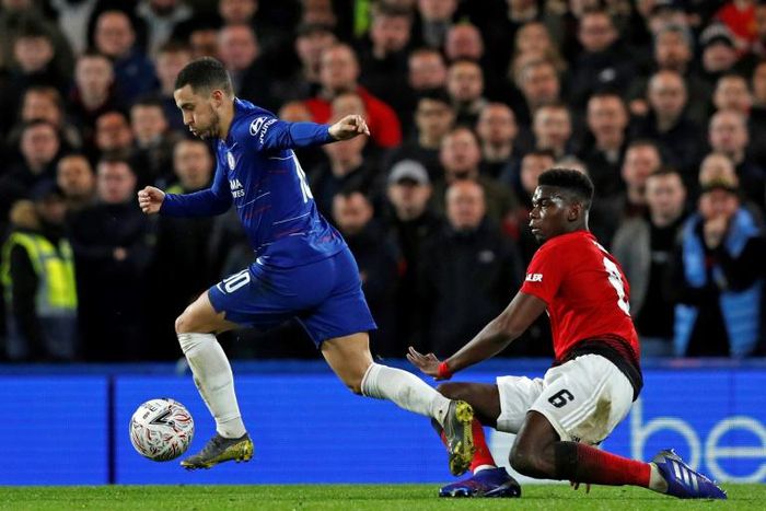 Future teammates? Chelsea's Eden Hazard (left) and Manchester United midfielder Paul Pogba (right) have both been linked with a move to Real Madrid
