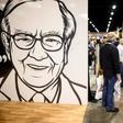 People pass an illustration of Warren Buffett, CEO of Berkshire Hathaway, during the 2019 annual shareholders meeting in Omaha, Nebraska