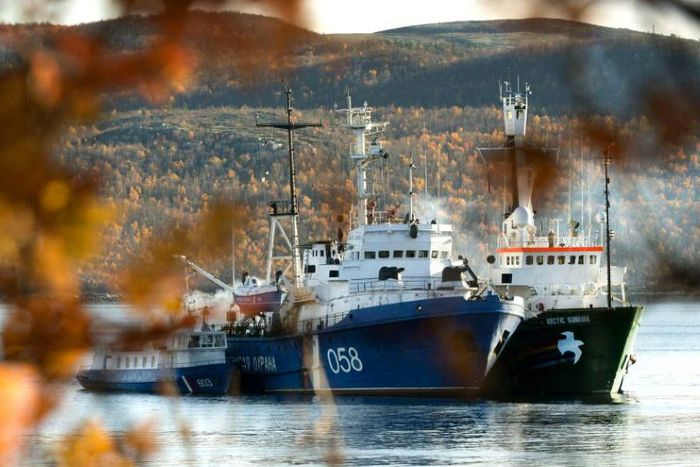The Greenpeace Arctic Sunrise ship moored next to a Russian Coast Guard ship in the northern Russian port of Murmansk in 2013