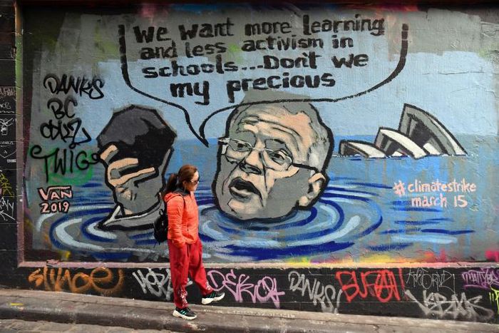 Mural in Melbourne shows Australian Prime Minister Scott Morrison holding a lump of coal as it advertises a rally by students around the world to protest climate change