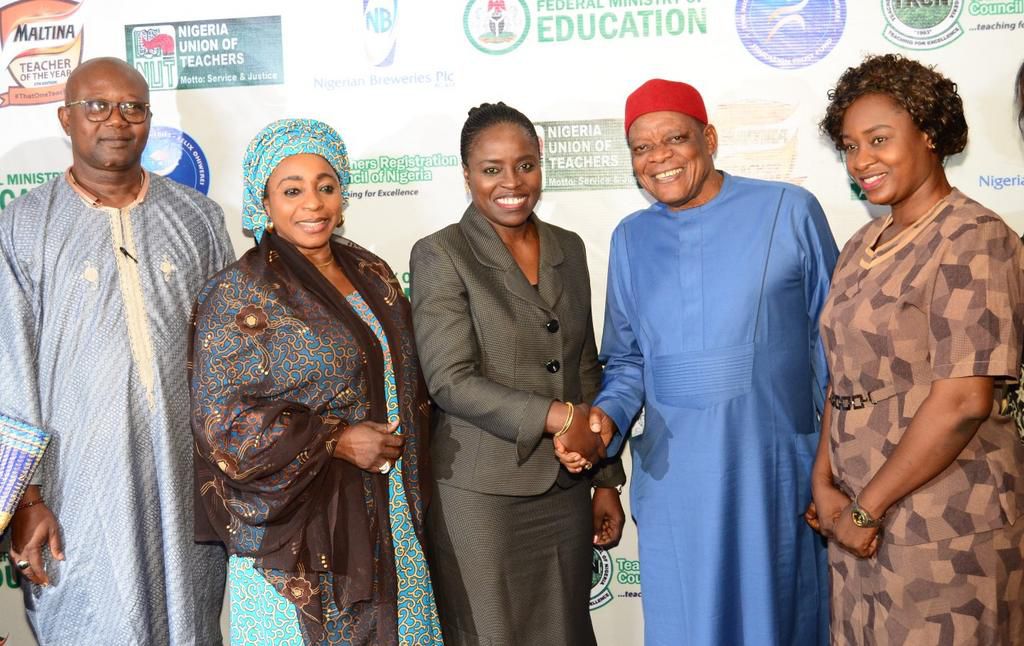 L-R; The President, All Nigeria Confederation of Principals of Secondary Schools (ANCOPSS), Principal Anselm Izuagie; Director, Basic & Secondary Education, Federal Ministry of Education, Dr. Lami Amodu; Corporate Affairs Director, Nigerian Breweries P...