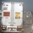 Trucks line up to cross from Mexico to the United States near the border in Tijuana