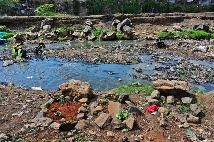 Rock arrangements mark the ground where authorities say bodies, mostly babies, were recovered from Nairobi's rivers
