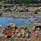 Rock arrangements mark the ground where authorities say bodies, mostly babies, were recovered from Nairobi's rivers