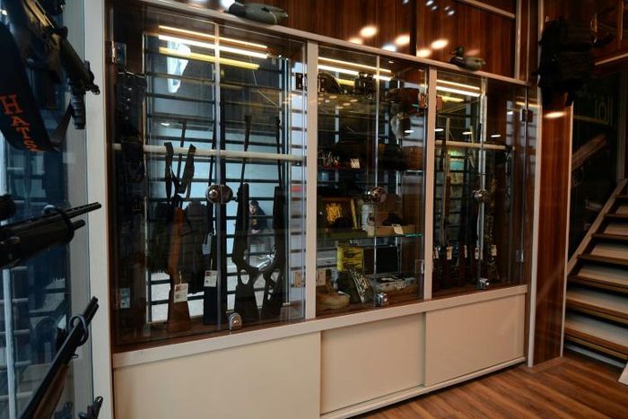 Rifles and other items are displayed in a gunshop in the northern Iraqi city of Mosul