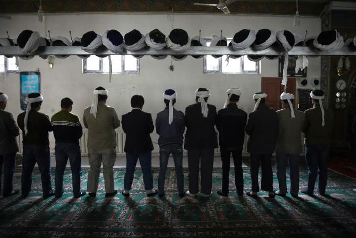 Uighur's pray in Xinjiang in 2015. UN chief Antonio Guterres was under pressure from rights groups to publicly confront Beijing over the mass detention of the Muslim minority