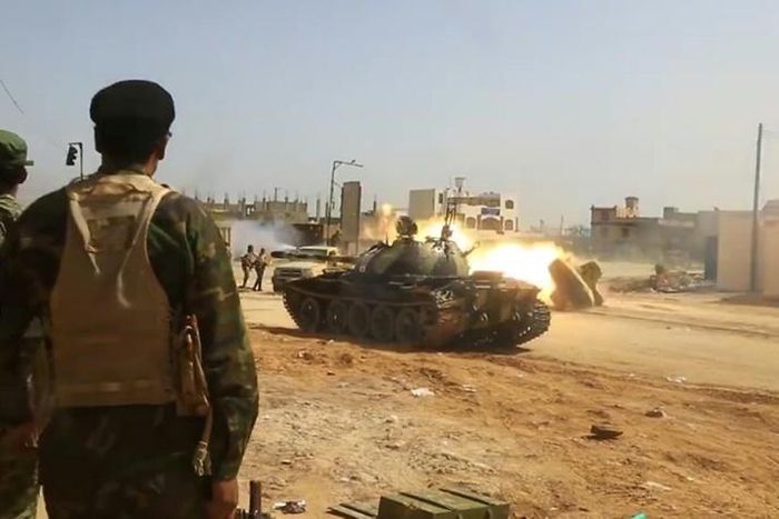 Image from a video published on the Libyan strongman Khalifa Haftar's self-proclaimed Libyan National Army War Information Division's Facebook page on April 16, 2019, shows a tank firing its turret reportedly in a southern suburb of the capital Tripoli...
