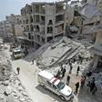 Members of the Syrian Civil Defence, also known as the "White Helmets", search the rubble of a collapsed building following an explosion in the town of Jisr al-Shughur, in the mostly rebel-held Syrian province of Idlib, on April 24, 2019