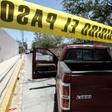 Police guard the site where forensic investigators have exhumed bodies from a mass grave in a farm in Zapopan, in Mexico's Jalisco state