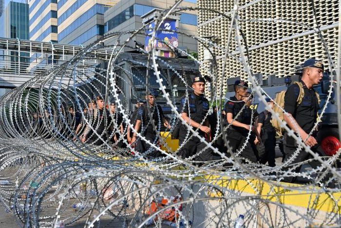 Police are keeping a close eye on the election supervisory agency amid fears of more unrest