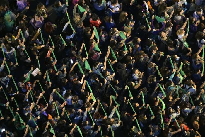 Women raise green headscarfs demanding the legalization of legal, safe and free abortion during a demonstration on the International Women's Day in Buenos Aires on March 8, 2019 -- activists are again working to see abortion legalized in Argentina