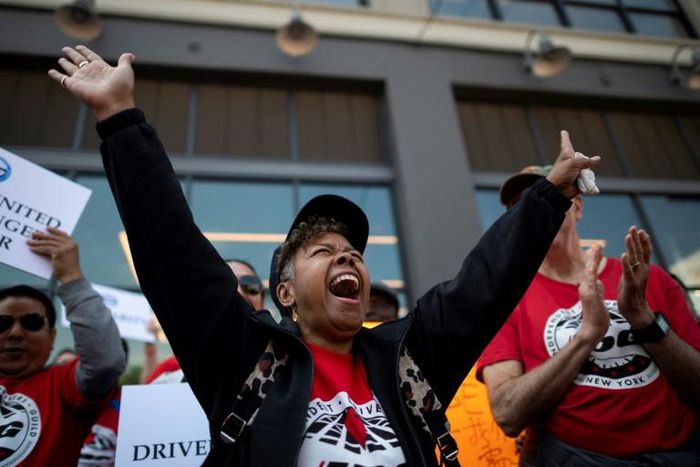 Members of the Independent Drivers Guild rallied at Uber and Lyft headquarters in New York as part of a protest to press demands for better pay and working conditions for the independent contractors