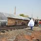 The tanker truck tipped over and exploded after crowds tried to collect spilt fuel