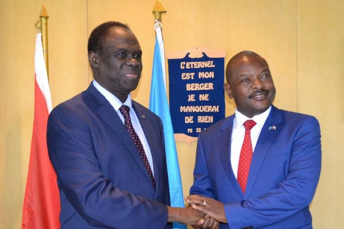 UN envoy for Burundi Michel Kafando (left) shakes hands with President Pierre Nkurunziza during a visit in 2017