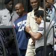Abdul Kadir (center, in pale suit), a former Guyana parliamentarian, was sentenced to life in prison in the United States after being found guilty of plotting a 2007 bomb attack at John F. Kennedy International Airport in New York