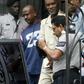 Abdul Kadir (center, in pale suit), a former Guyana parliamentarian, was sentenced to life in prison in the United States after being found guilty of plotting a 2007 bomb attack at John F. Kennedy International Airport in New York