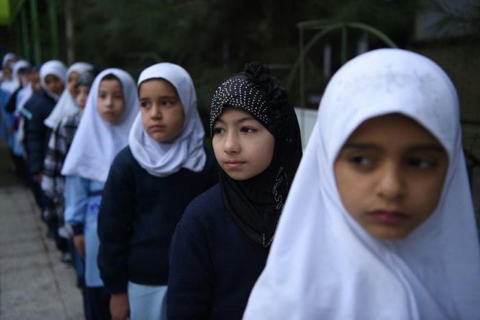 Afghan schoolgirls line up for class. UNICEF says almost half Afghanistan's children have been deprived of the right to education