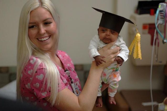 In this picture received by AFP from Sharp Mary Birch Hospital for Women & Newborns on May 29, 2019, shows a nurse holding baby Saybie, the world's smallest surviving newborn, on the day she was released from the NICU in San Diego, California