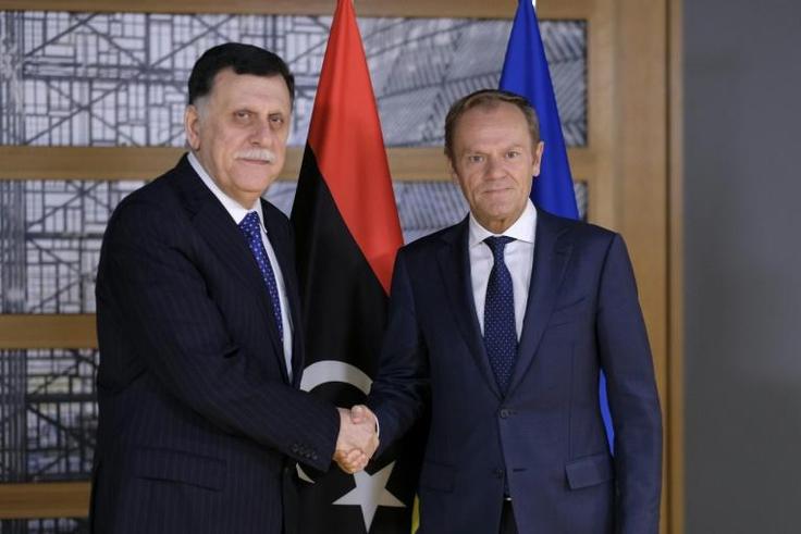 President of the European Council, Donald Tusk (R) welcomes Libyan Prime Minister Fayez al-Sarraj prior to a meeting in Brussels on May 13, 2019. Libyan strongman Khalifa Haftar's offensive against Tripoli represents a threat to international peace, th...