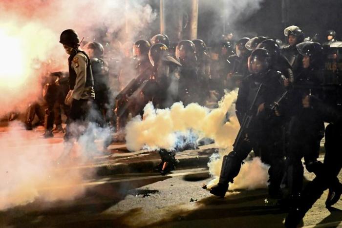 Police in Jakarta clashed with some anti-Widodo protesters who had refused to leave after the end of an otherwise peaceful demonstration