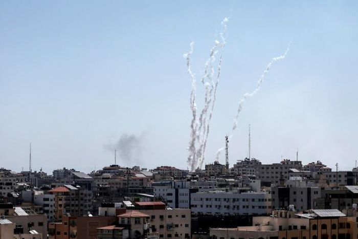 Palestinian militants in Gaza fire a barrage of rockets at Israel, prompting retaliatory air strikes as a fragile ceasefire again falters