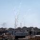 Palestinian militants in Gaza fire a barrage of rockets at Israel, prompting retaliatory air strikes as a fragile ceasefire again falters