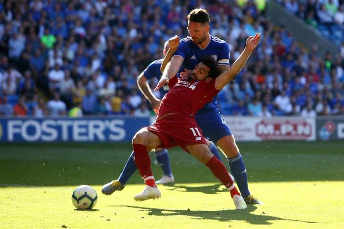 Going down: Liverpool's Egyptian midfielder Mohamed Salah is fouled by Cardiff defender Sean Morrison and a penalty is awarded