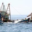 Indonesian authorities sink an impounded Vietnamese fishing boat at Datuk island,on May 4, 2019.