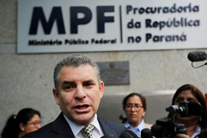 Peru's public prosecutor Rafael Vela, shown speaking to reporters in Curitiba, Brazil, said Odebrecht's former chief in Peru detailed "money routes" to Peruvian politicians