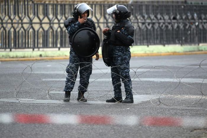 Iraqi security forces stand guard in Baghdad in this file picture taken on February 9, 2018