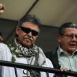 Former FARC commander Jesus Santrich (L) greets supporters after the Supreme Court ordered his release in Bogota, Colombia on May 30, 2019
