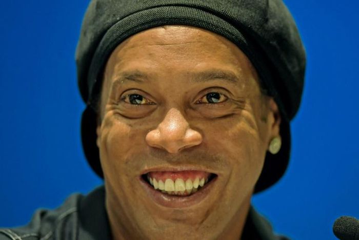 Former FC Barcelona and Brazil national Ronaldinho -- a supporter of right-wing President Jair Bolsonaro -- decries corruption in a rap duet video released on YouTube