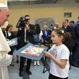 Pope Francis meets a young girl in a refuge camp in Bulgaria where he spoke of their sufferings and the need for others to help them