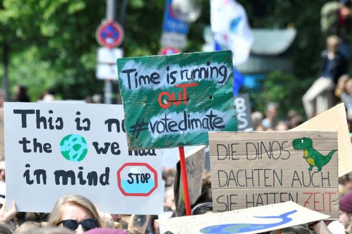 Young demonstrators urged their elders to treat climate change with greater urgency, with one banner held aloft in Berlin reminding them that "the dinosaurs also thought they had time" before they were wiped out