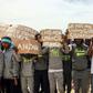 Migrants hold placards during United Nations Secretary-General Antonio Guterres (unseen) visit to Ain Zara detention centre for migrants in the Libyan capital Tripoli on April 4, 2019