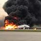 Flames and thick smoke were pouring from the aircraft as it landed