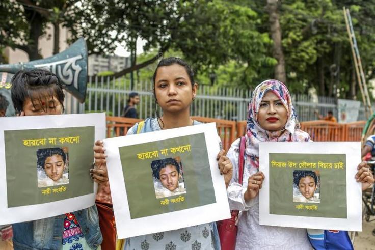Bangladeshi women hold posters of murdered schoolgirl Nusrat Jahan Rafi at a protest in Dhaka. Authorities have ordered state-funded Islamic seminaries to appoint female mentors to prevent violence against women and children