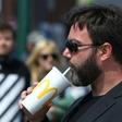 UKIP European Parliament candidate Carl Benjamin, who has had milkshakes thrown at him at least four times this month, made a show of sipping on a McDonald's milkshake at one of his events this week
