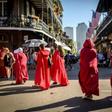 Protesters, dressed as characters in the dystopian novel and TV series "The Handmaid's Tale," march through the French Quarter of New Orleans, Louisiana, on May 25, 2019, to protest the bill to restrict abortion