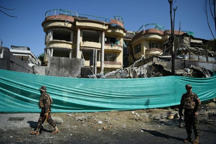 The massive explosion felled trees and toppled dense concrete blast walls on the street outside the Counterpart International compound in Kabul