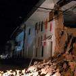 Handout picture released by the Peruvian Fire Department showing a house damaged by an 8.0 earthquake in Yurimaguas, Peru, early on May 26