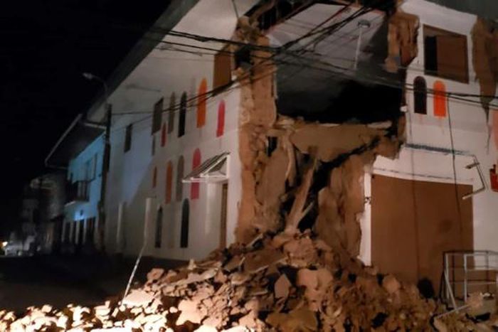 Handout picture released by the Peruvian Fire Department showing a house damaged by an 8.0 earthquake in Yurimaguas, Peru, early on May 26