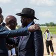 South Sudan President Salva Kiir (R) has pledged that his government will respect a tenuous peace agreement for the country